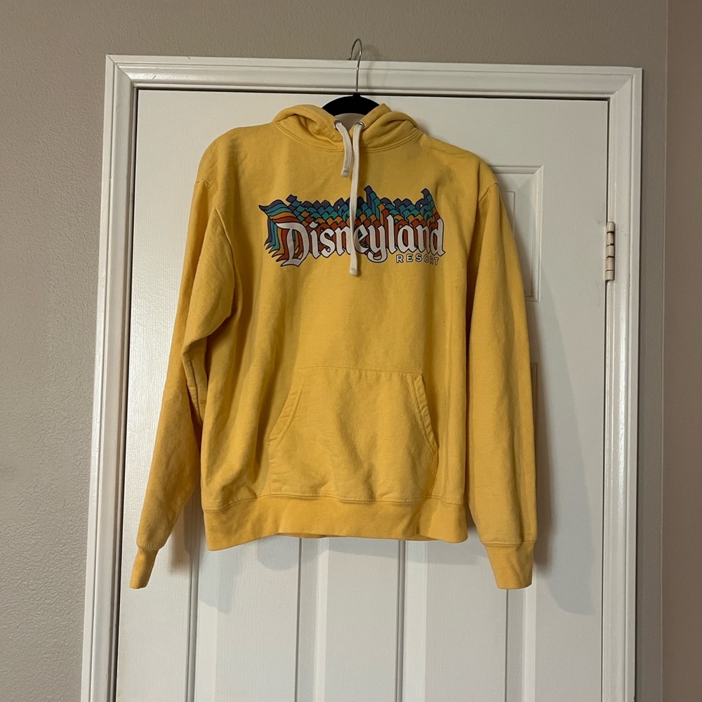 GUC Disneyland yellow hoodie size Medium. Front pocket. Cotton/poly combo.
